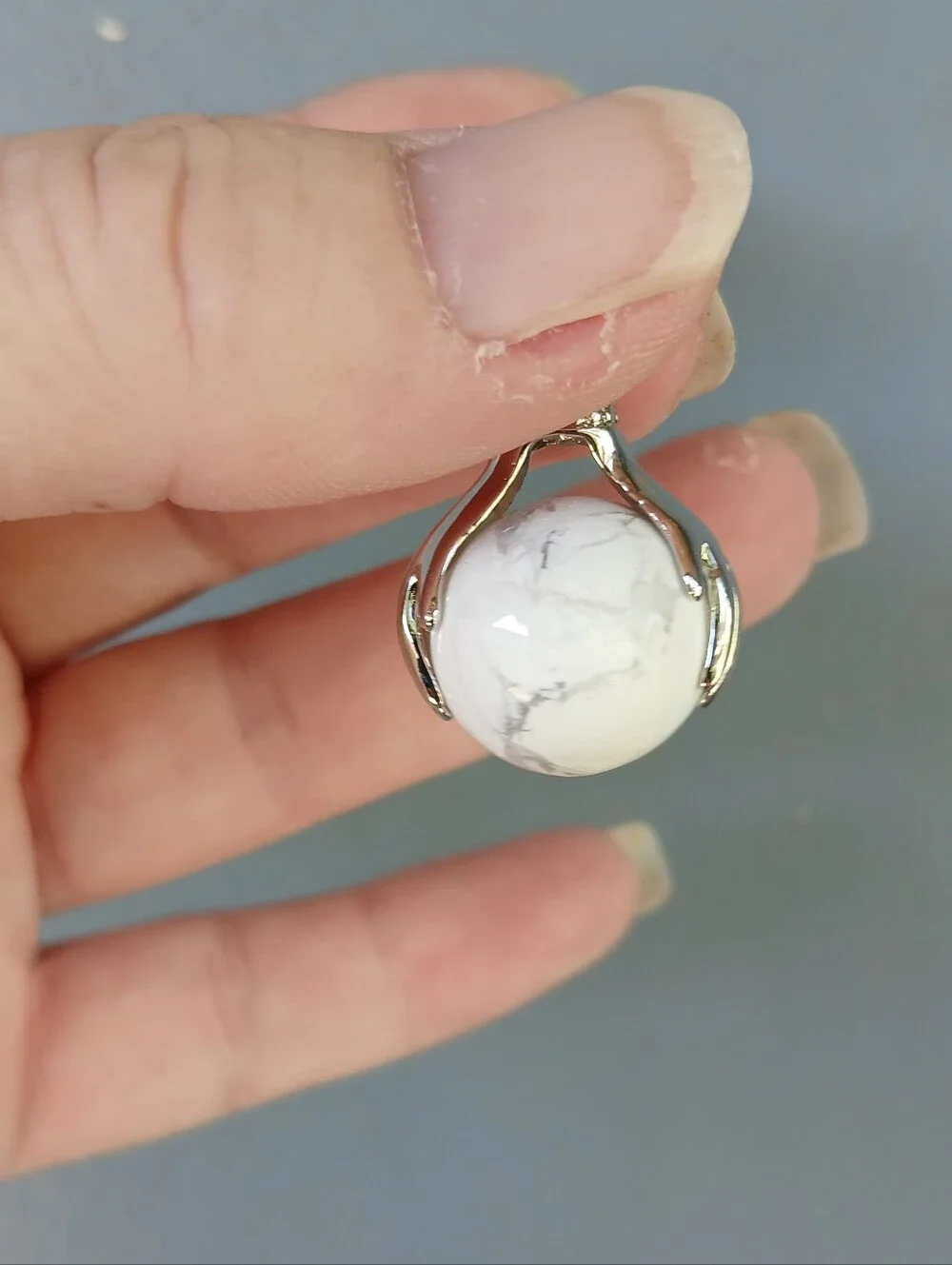 New 18K Hands Holding Howlite Sphere Pendant.